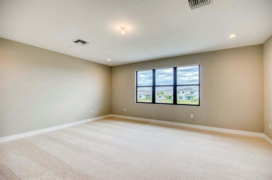 Furnished interior view inside a new home in Apex at Avenir, Palm Beach Gardens (Image 19).