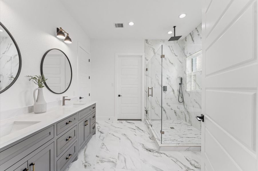 Spa-inspired bath with soaking tub, oversized walk-in shower, and double vanities.Upgraded finishes and thoughtful layout make this a luxurious everyday escape. Spa-inspired bath with soaking tub, oversized walk-in shower, and double vanities.Upgraded finishes and thoughtful layout make this a luxurious everyday escape.