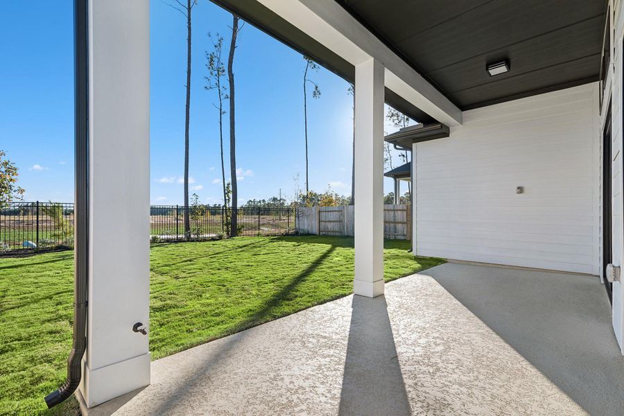 Exterior details and patio area of a home in ARTAVIA 50' Homesites, Conroe (Image 28).