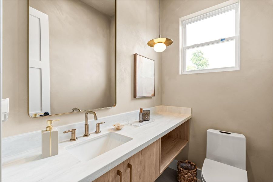 Wrapped in a soft, hand-finished limewash, this powder room feels like a little indulgence tucked into everyday life. It's the kind of detail guests remember and comment on.