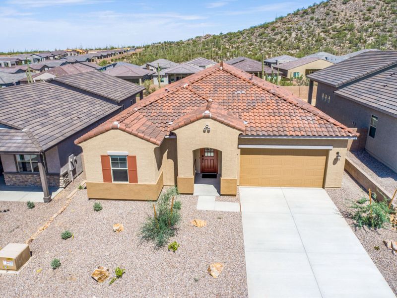 Front exterior of a new home in Saguaro Reserve II, Marana, AZ, highlighting curb appeal (Image 2).
