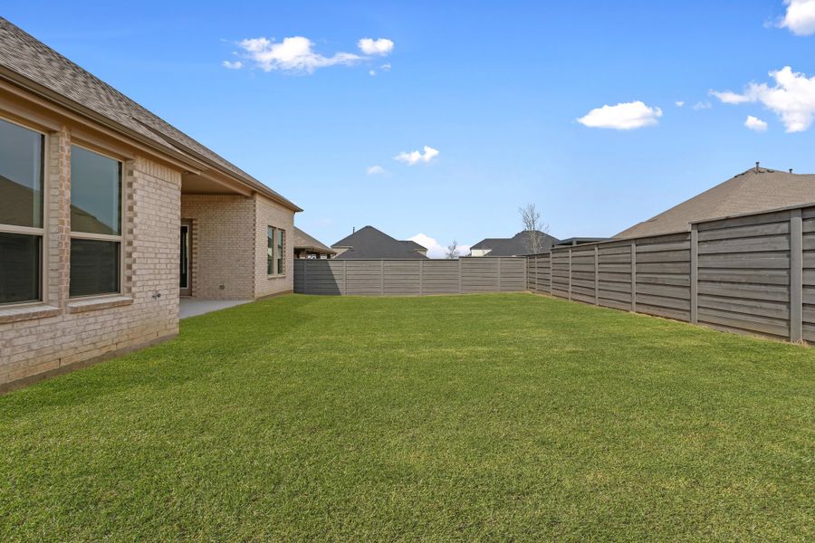 Exterior details and patio area of a home in Union Park, Little Elm (Image 15). Exterior details and patio area of a home in Union Park, Little Elm (Image 15).