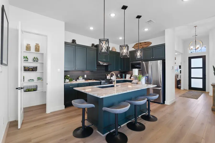 Furnished interior view inside a new home in Sienna, Missouri City (Image 17).