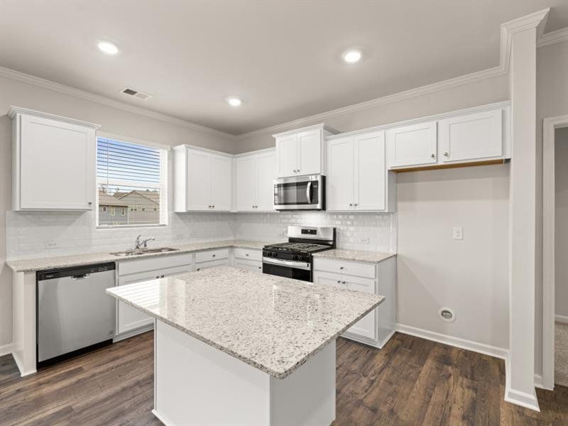 Furnished interior view inside a new home in Northwoods at Mirror Lake, Villa Rica (Image 7).
