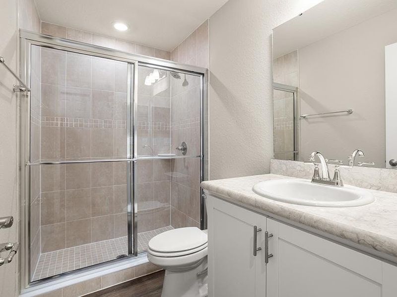 Your en-suite owner`s bath features a tiled, glass-enclosed shower. Your en-suite owner`s bath features a tiled, glass-enclosed shower.