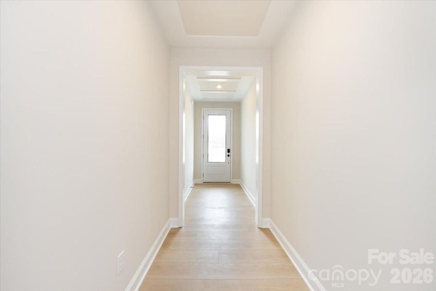 Foyer hallway with ceiling trim