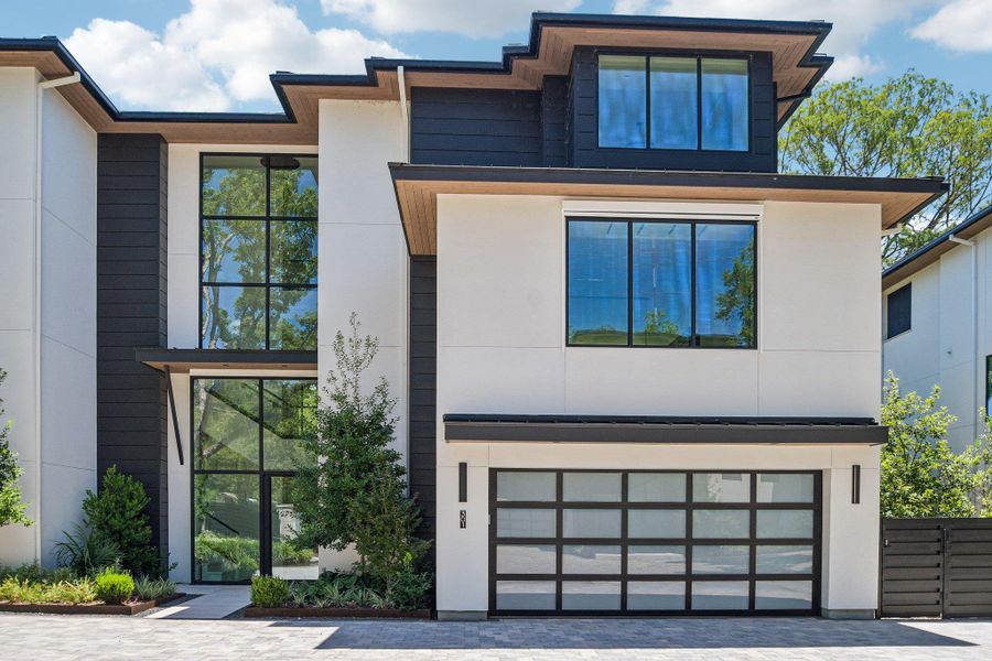 Striking contemporary architecture showcases clean geometric lines and towering walls of glass. Striking contemporary architecture showcases clean geometric lines and towering walls of glass.