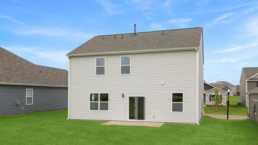 Exterior details and patio area of a home in Durbin Meadows Traditions, Fountain Inn (Image 4).