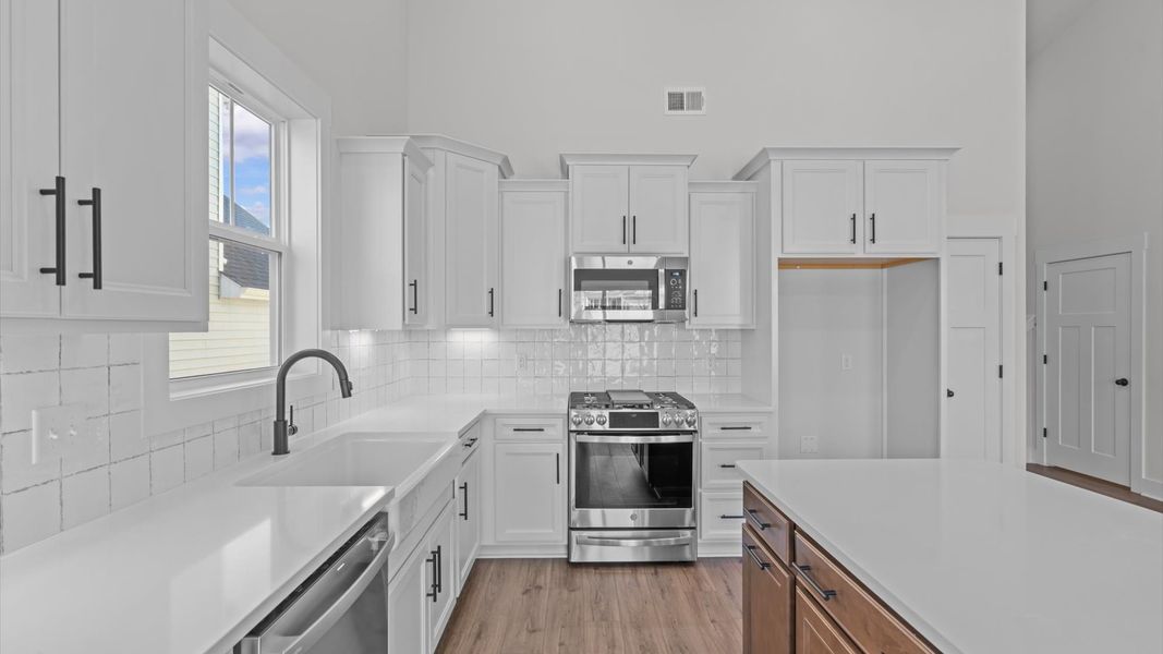 Accomplished design in a kitchen that blends function and form with a right-sized island