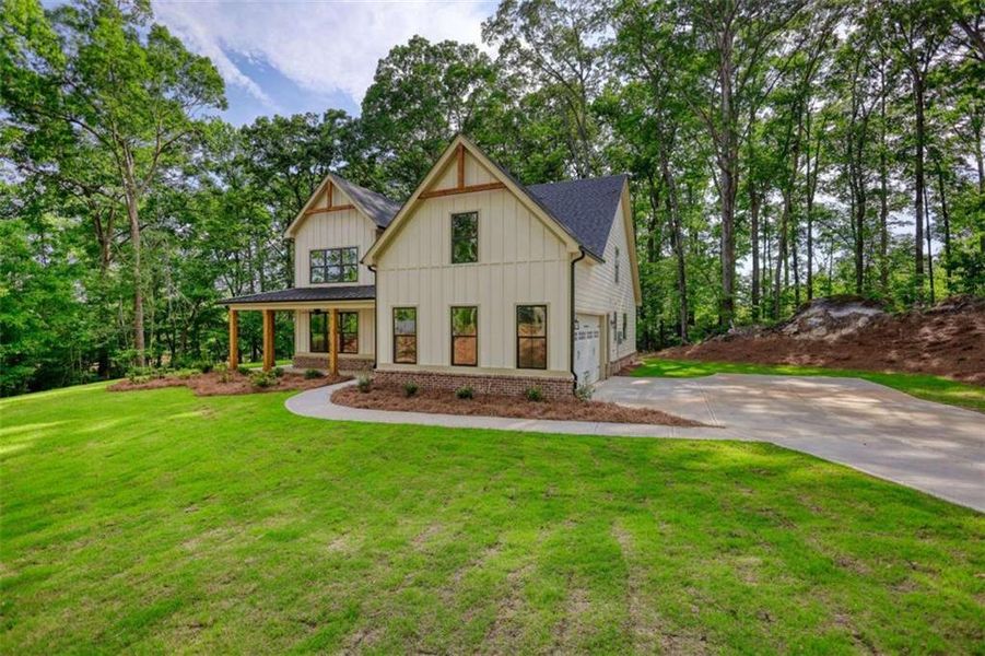 Front exterior of a new home in , Monticello, GA, highlighting curb appeal (Image 25).