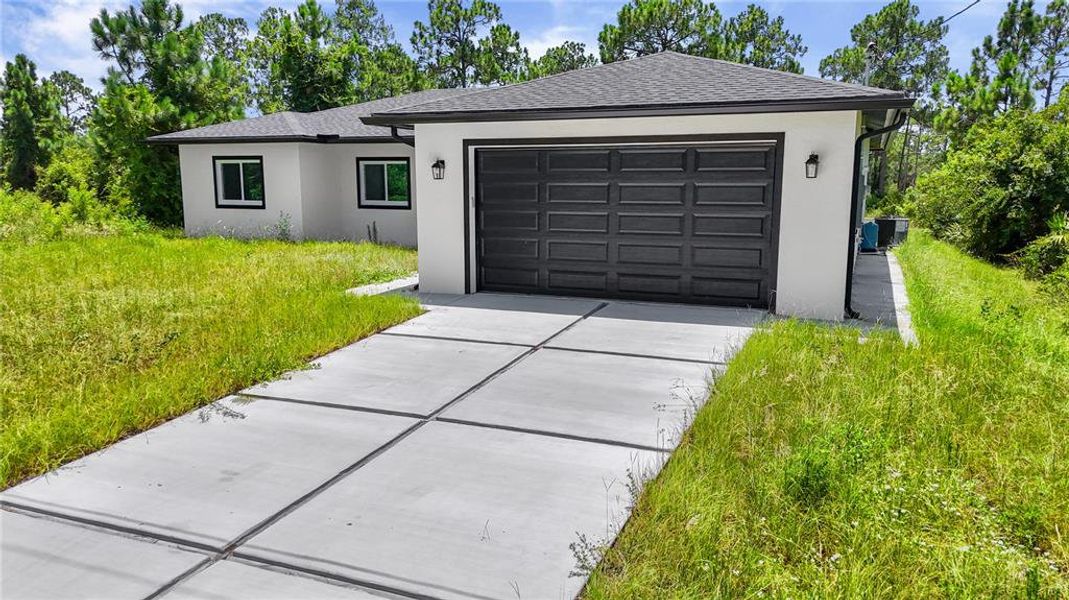 Front exterior of a new home in , Lehigh Acres, FL, highlighting curb appeal (Image 1). Front exterior of a new home in , Lehigh Acres, FL, highlighting curb appeal (Image 1).