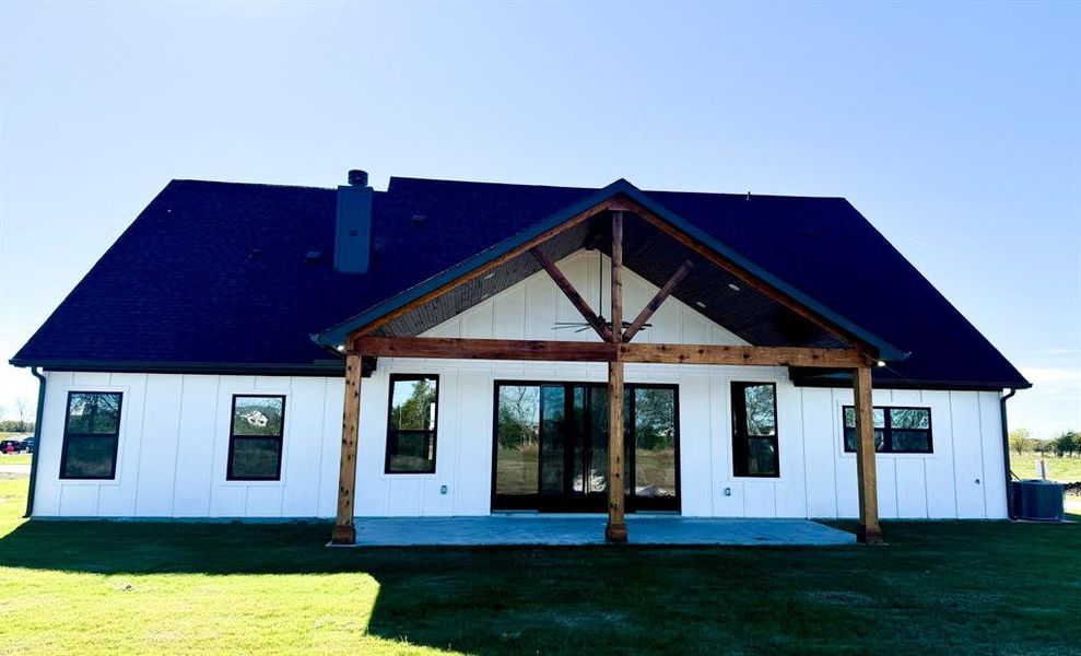 Back of house featuring a yard and a patio area