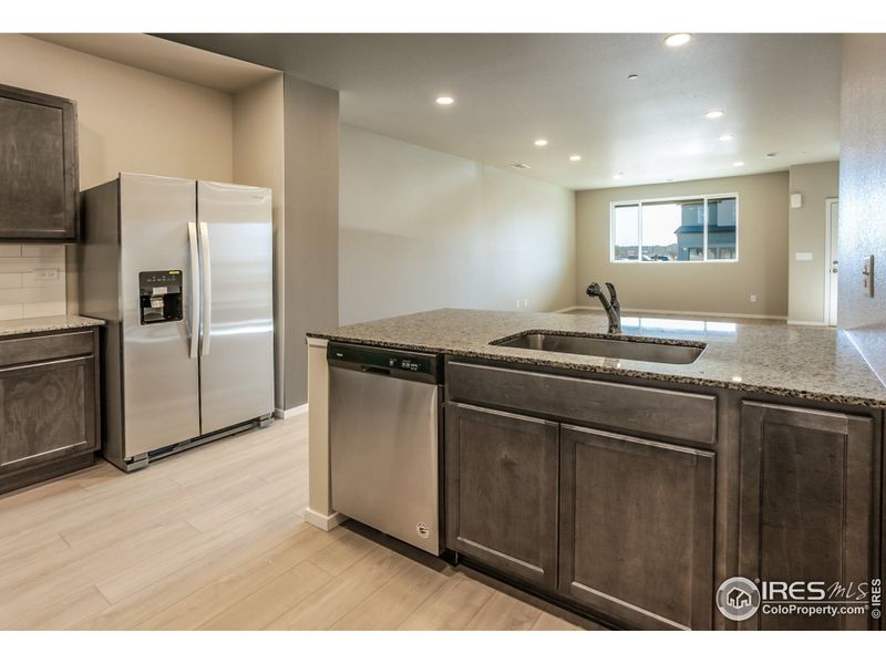 EXAMPLE PHOTO: KITCHEN OPEN TO DINING AND LIVING