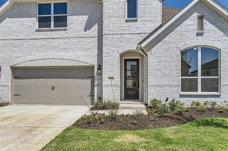 View of front of property with a garage