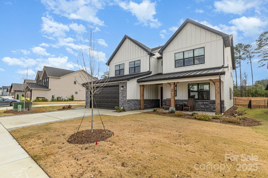 Front exterior of a new home in Windell Woods, Tega Cay, SC, highlighting curb appeal (Image 2).