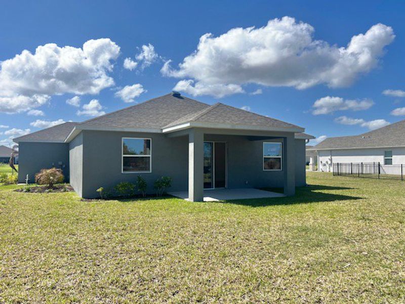 Exterior details and patio area of a home in Lakes At St Sebastian, Micco (Image 20).