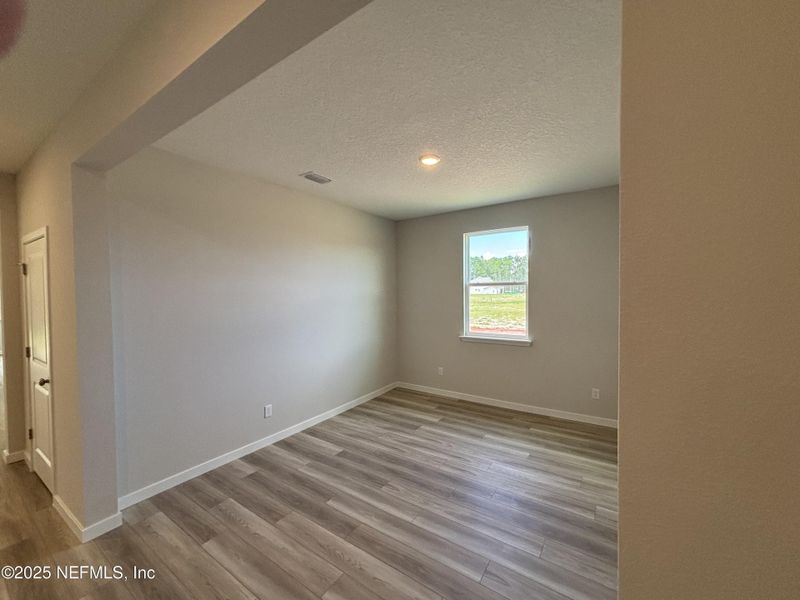 Spacious, unfurnished interior of a new home in The Cypress Series at Reserve East, Flagler Beach (Image 10).