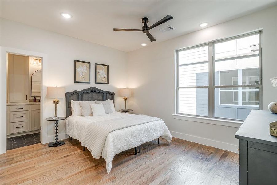 Thoughtfully designed bedroom with abundant natural light and storage space. Thoughtfully designed bedroom with abundant natural light and storage space.