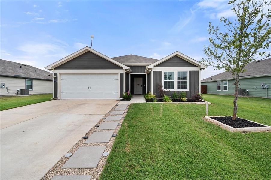 Front exterior of a new home in Corsicana Commons, Corsicana, TX, highlighting curb appeal (Image 20).