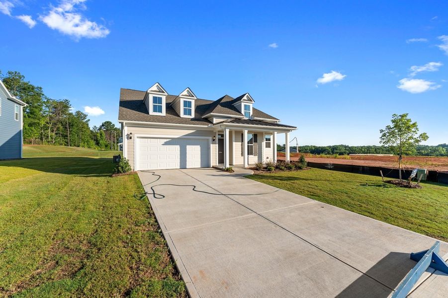 Front exterior of a new home in Cottages at Lake Emory, Inman, SC, highlighting curb appeal (Image 2). Front exterior of a new home in Cottages at Lake Emory, Inman, SC, highlighting curb appeal (Image 2).