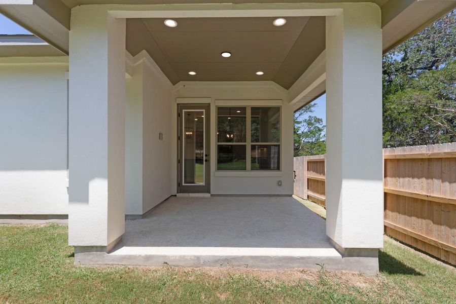 A spacious covered patio provides an ideal setting for outdoor enjoyment.