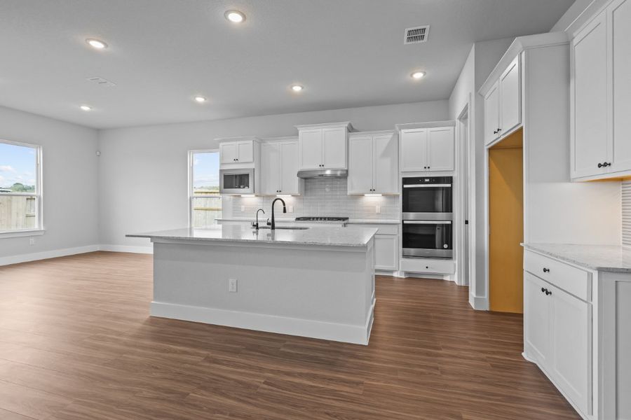 A kitchen with white cabinets. A kitchen with white cabinets.