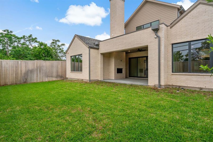 The back yard features plenty of space to add a pool, putting green, or any other outdoor features you desire.