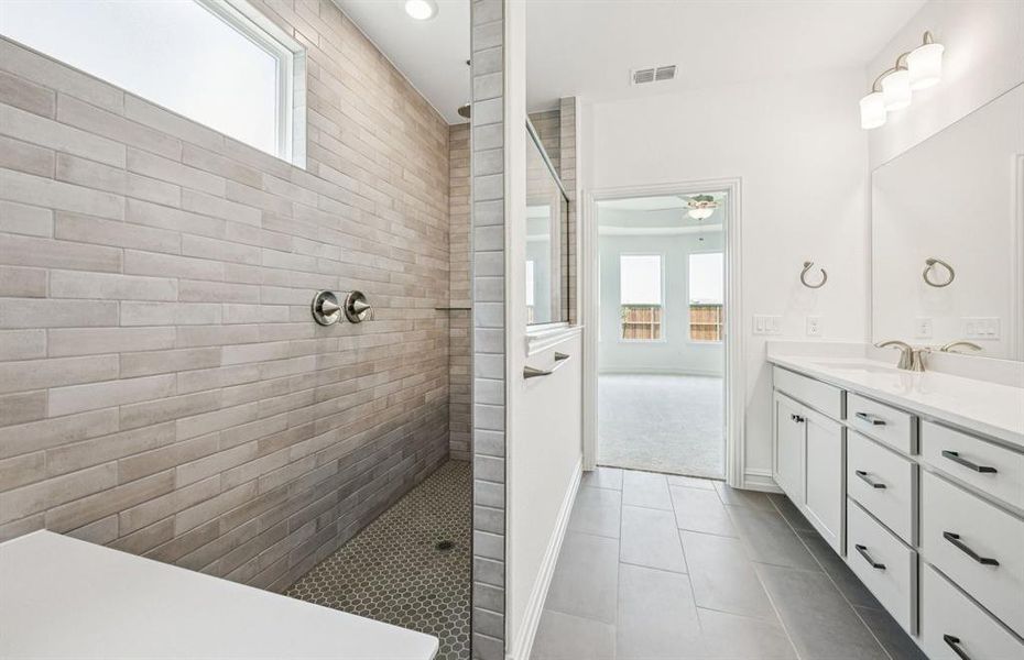 Deep walk-in shower designed for relaxation in the owner's bath *Real home pictured Deep walk-in shower designed for relaxation in the owner's bath *Real home pictured