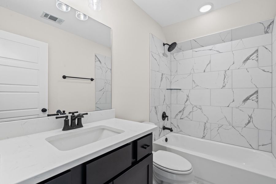 Full bath with tub / shower combination and vanity Full bath with tub / shower combination and vanity