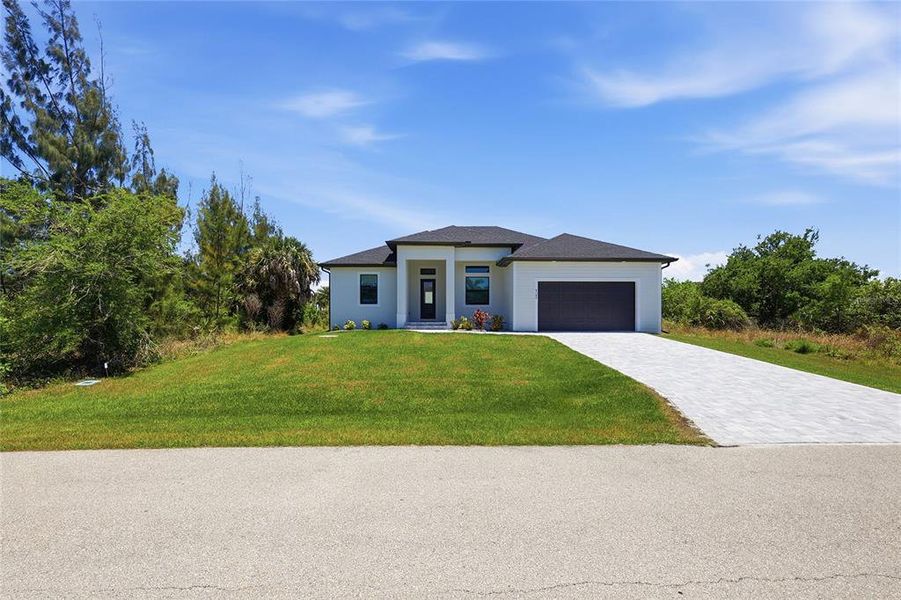 Front exterior of a new home in , Port Charlotte, FL, highlighting curb appeal (Image 25).