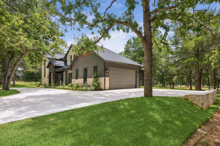 Look at all the mature trees and long driveway. Country living at its finest. Look at all the mature trees and long driveway. Country living at its finest.