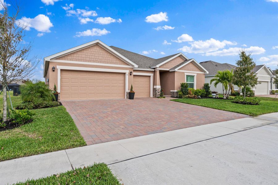 Front exterior of a new home in Grande Hammock, Vero Beach, FL, highlighting curb appeal (Image 2). Front exterior of a new home in Grande Hammock, Vero Beach, FL, highlighting curb appeal (Image 2).
