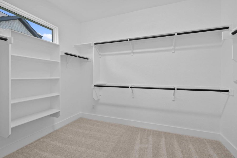 Walk-in closet in Primary Bedroom Walk-in closet in Primary Bedroom