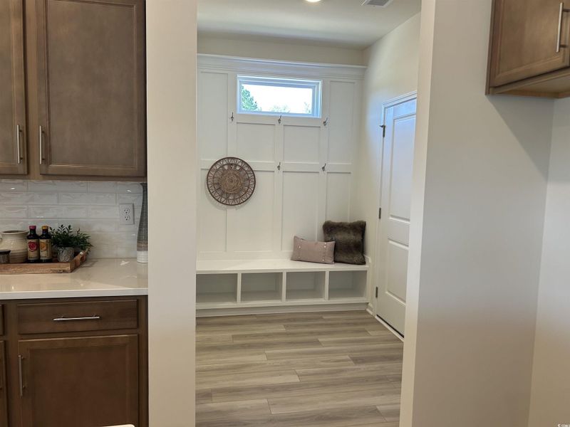 Mudroom featuring light wood-type flooring
