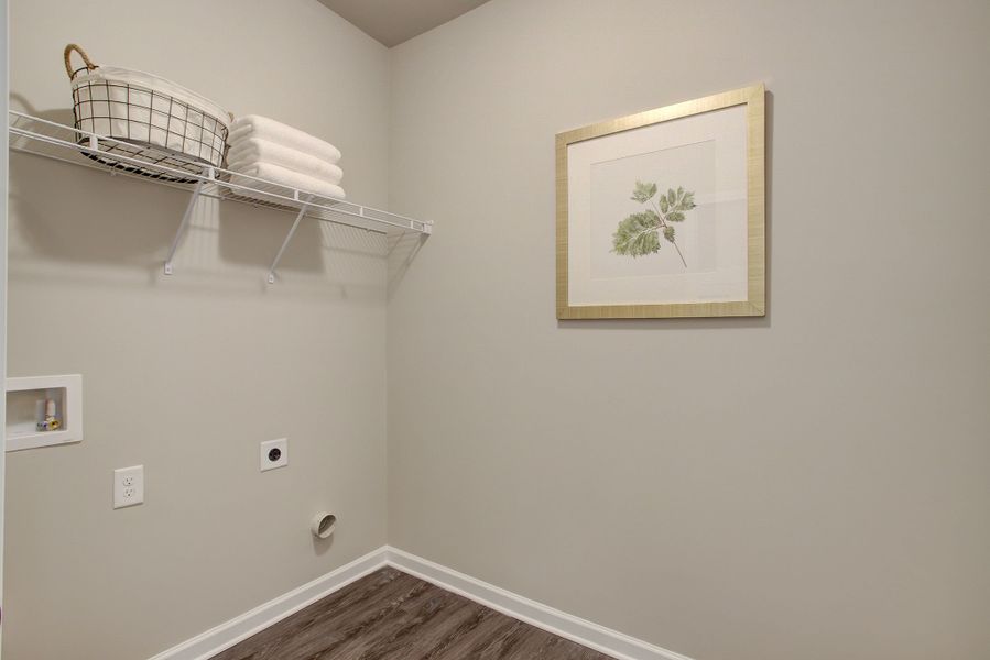 Laundry room off the primary bedroom