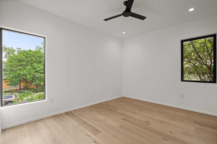 Unfurnished room featuring light wood finished floors, recessed lighting, and ceiling fan