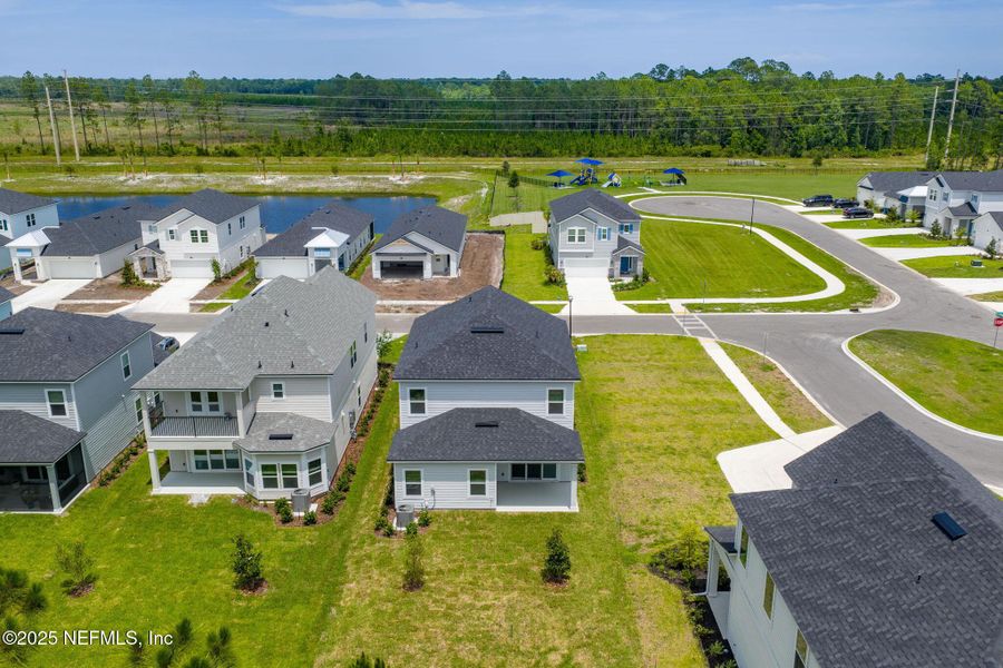 Front exterior of a new home in Beacon Lake, St. Augustine, FL, highlighting curb appeal (Image 25).