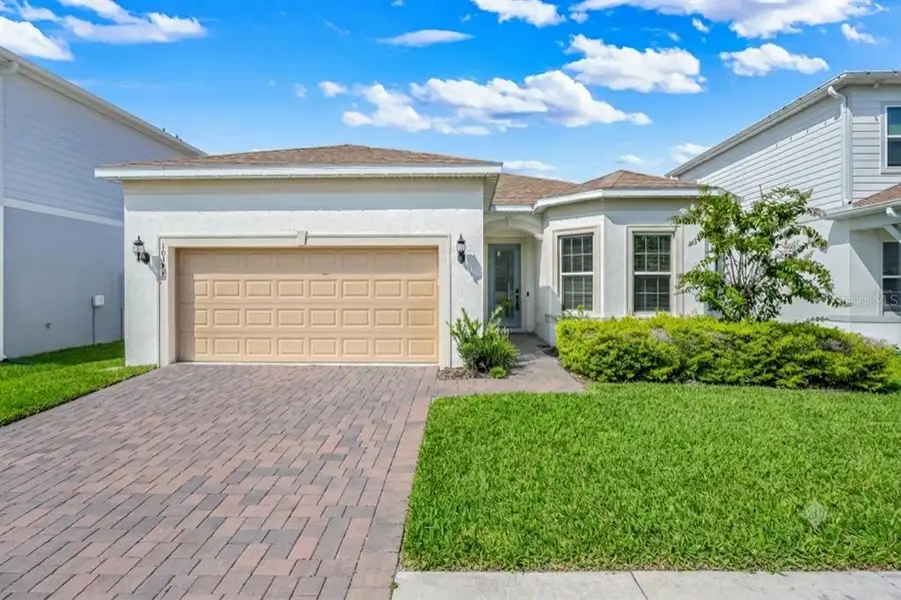 Front exterior of a new home in , Orlando, FL, highlighting curb appeal (Image 26). Front exterior of a new home in , Orlando, FL, highlighting curb appeal (Image 26).