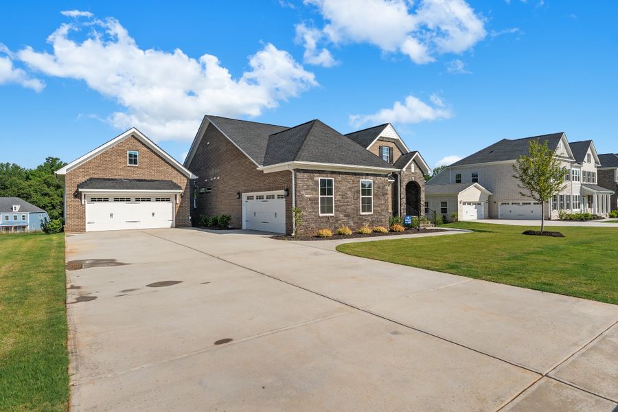 Front exterior of a new home in Walnut Grove, Easley, SC, highlighting curb appeal (Image 2). Front exterior of a new home in Walnut Grove, Easley, SC, highlighting curb appeal (Image 2).