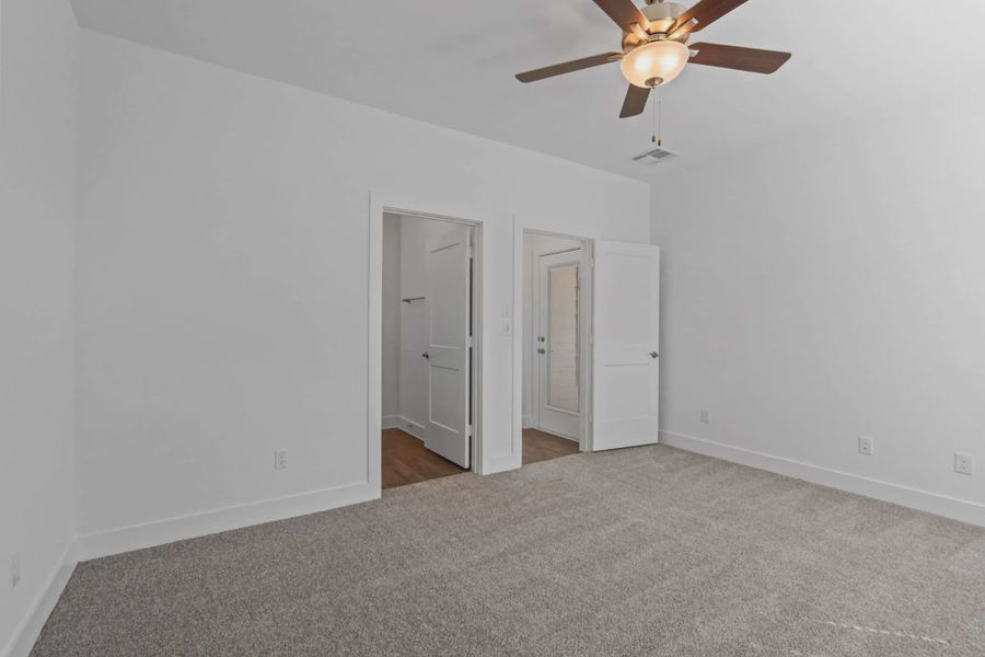 Representative unfurnished interior of a home built from the Carriagehouse by Chesmar Homes in Meridiana Townhomes, Iowa Colony (Image 75).