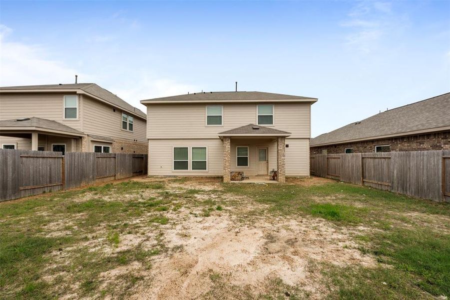 Covered patio and spacious backyard. Great for outside gatherings.