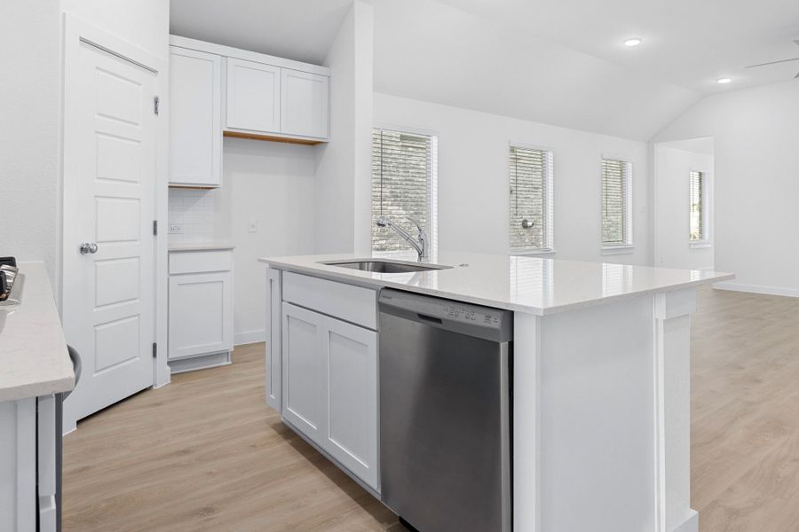 Kitchen in the Cypress home plan by Trophy Signature Homes - REPRESENTATIVE PHOTO