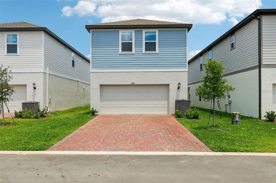 Front exterior of a new home in Silverleaf Reserve Bungalows, Winter Garden, FL, highlighting curb appeal (Image 19).