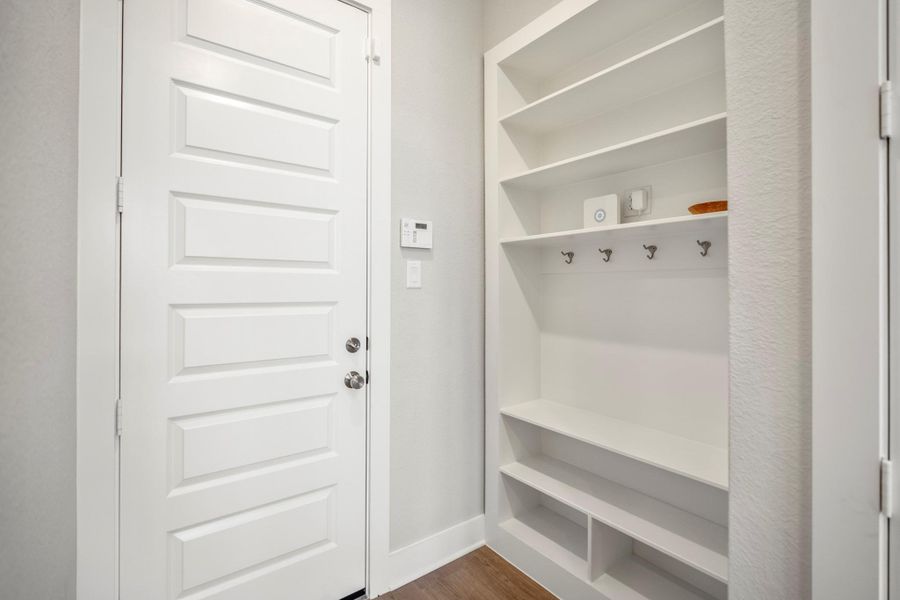 A designated drop zone near the garage entry keeps backpacks, shoes, keys and everyday essentials organized, making busy comings and goings a little easier.