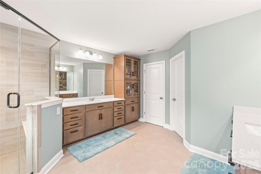 Upgraded cabinetry with picture frame glass fronts