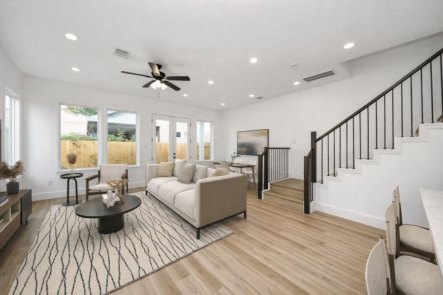 Spacious open-concept living with seamless flow to dining and kitchen areas. Bright, modern design ideal for both everyday living and entertaining.