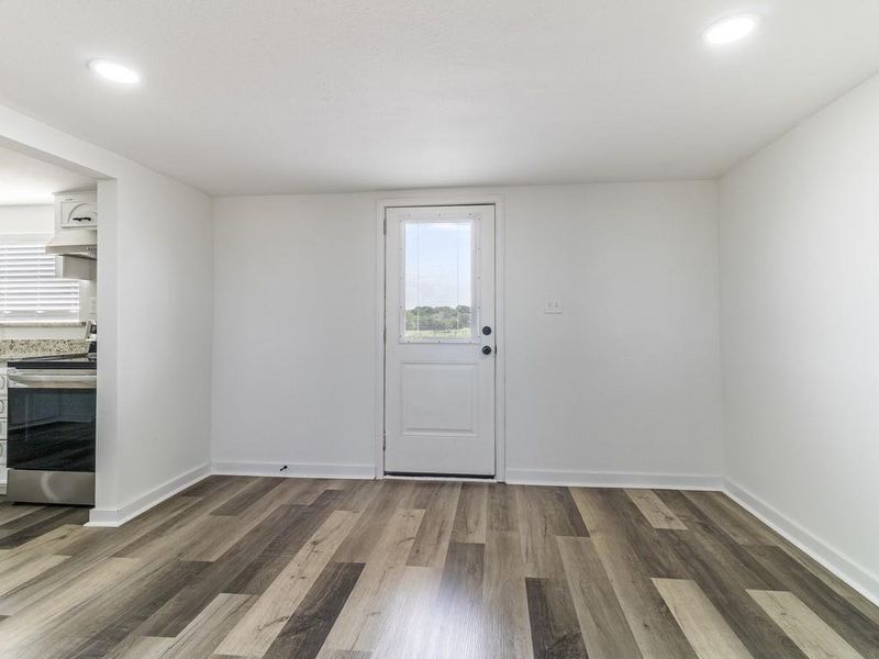 Entryway featuring wood finished floors and recessed lighting Entryway featuring wood finished floors and recessed lighting