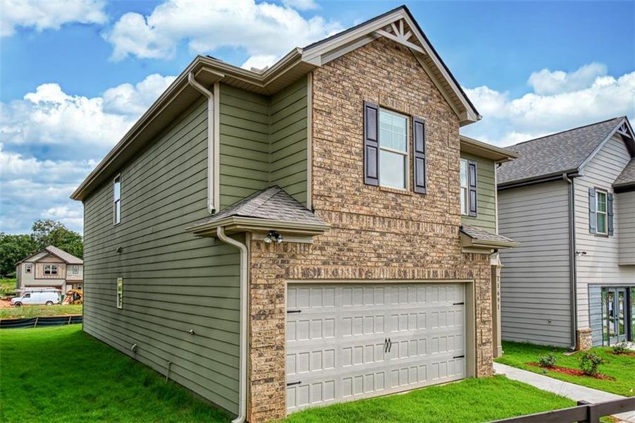Front exterior of a new home in Westminster, Covington, GA, highlighting curb appeal (Image 1).