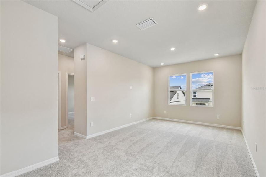 Spacious, unfurnished interior of a new home in Oakfield at Mount Dora Cottage Series, Mount Dora (Image 26).