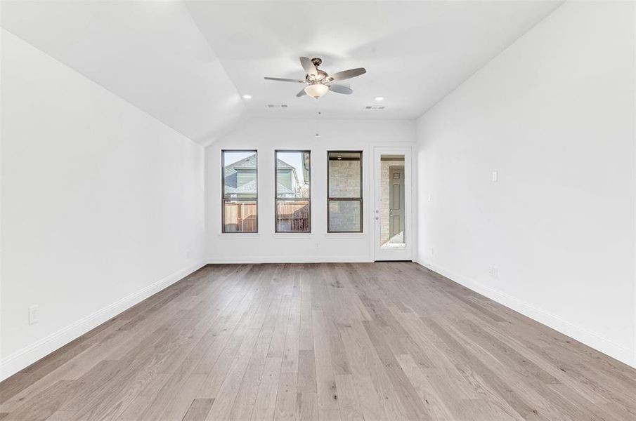 Spare room featuring light hardwood / wood-style floors and ceiling fan